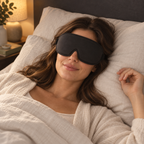 Illustrative AI-generated scene of a woman wearing the black round sleep mask on an ivory pillow; not a customer photo or verified fit/performance proof.