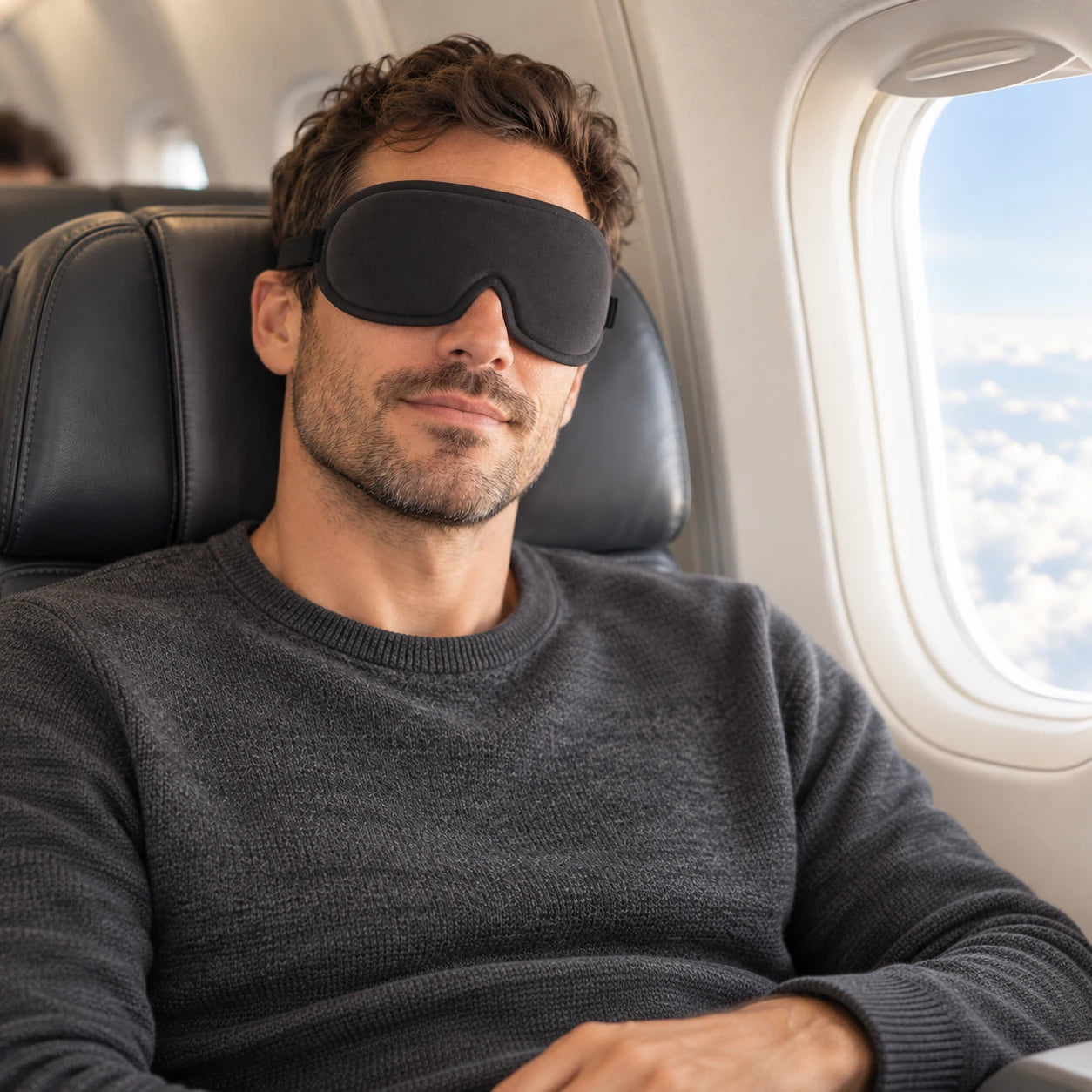 AI-generated illustration of a man wearing the black mask in an airplane seat; not verified fit or performance proof.